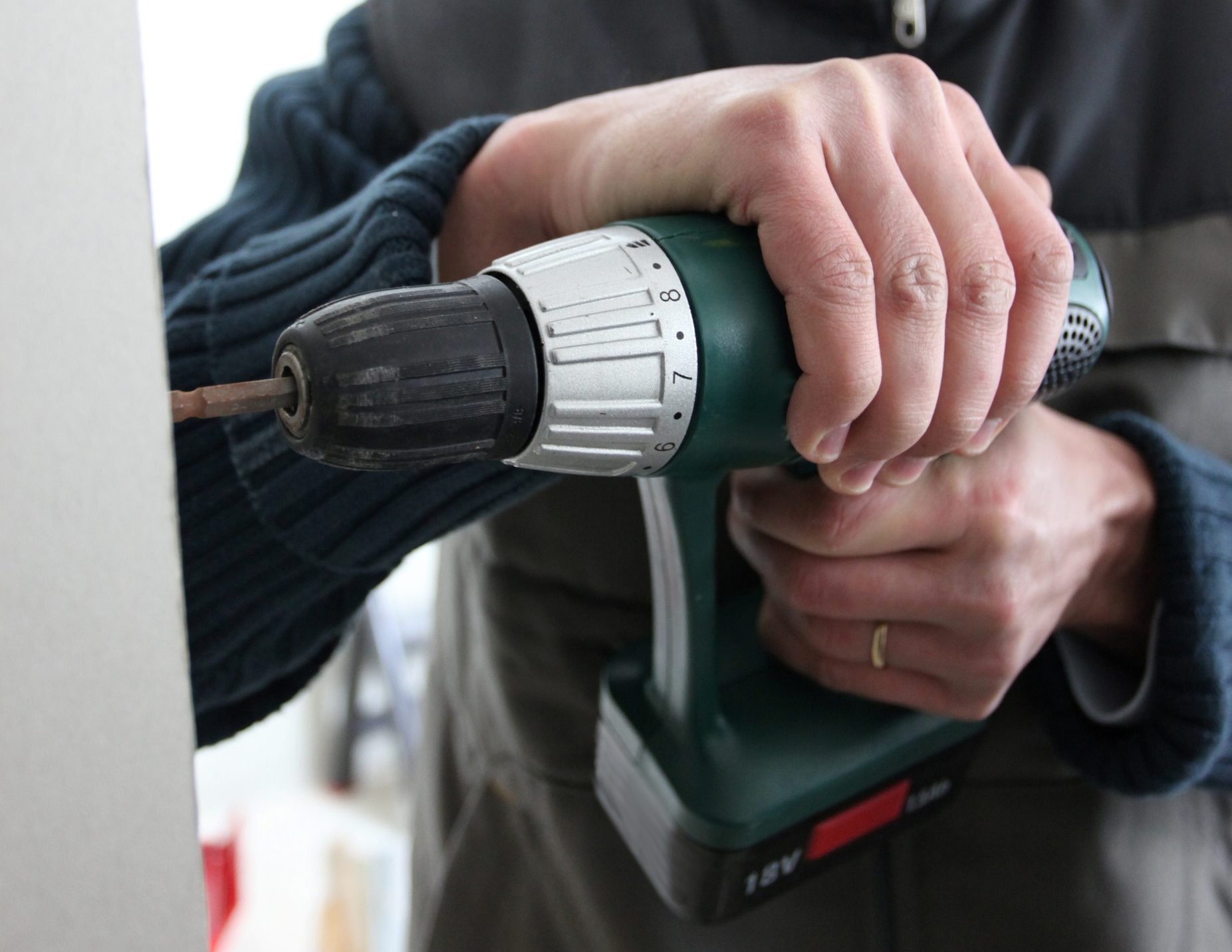 using a cordless drill on wall