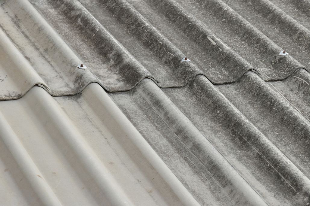 closeup of asbestos roof pattern in background