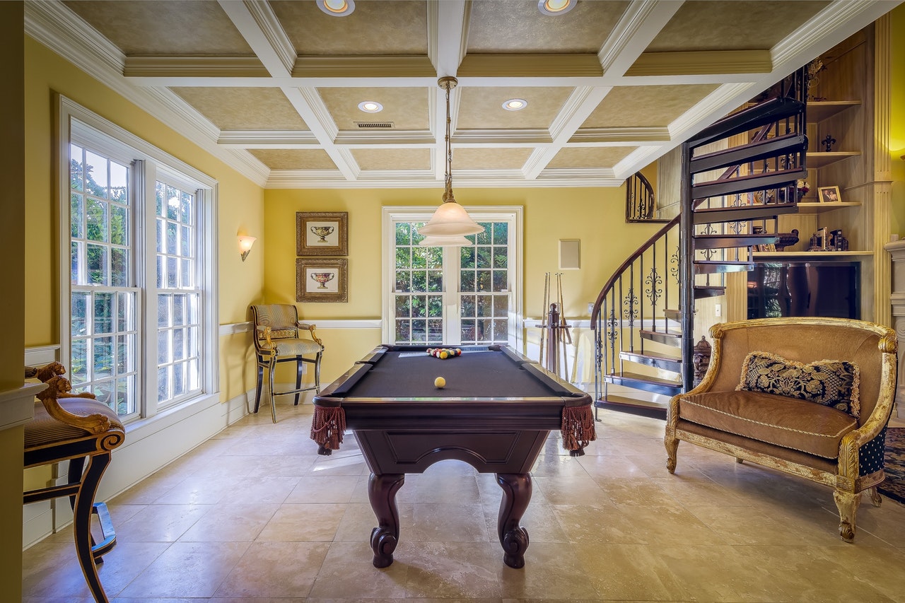 period family room with pool table yellow walls tiled floors winding stairs