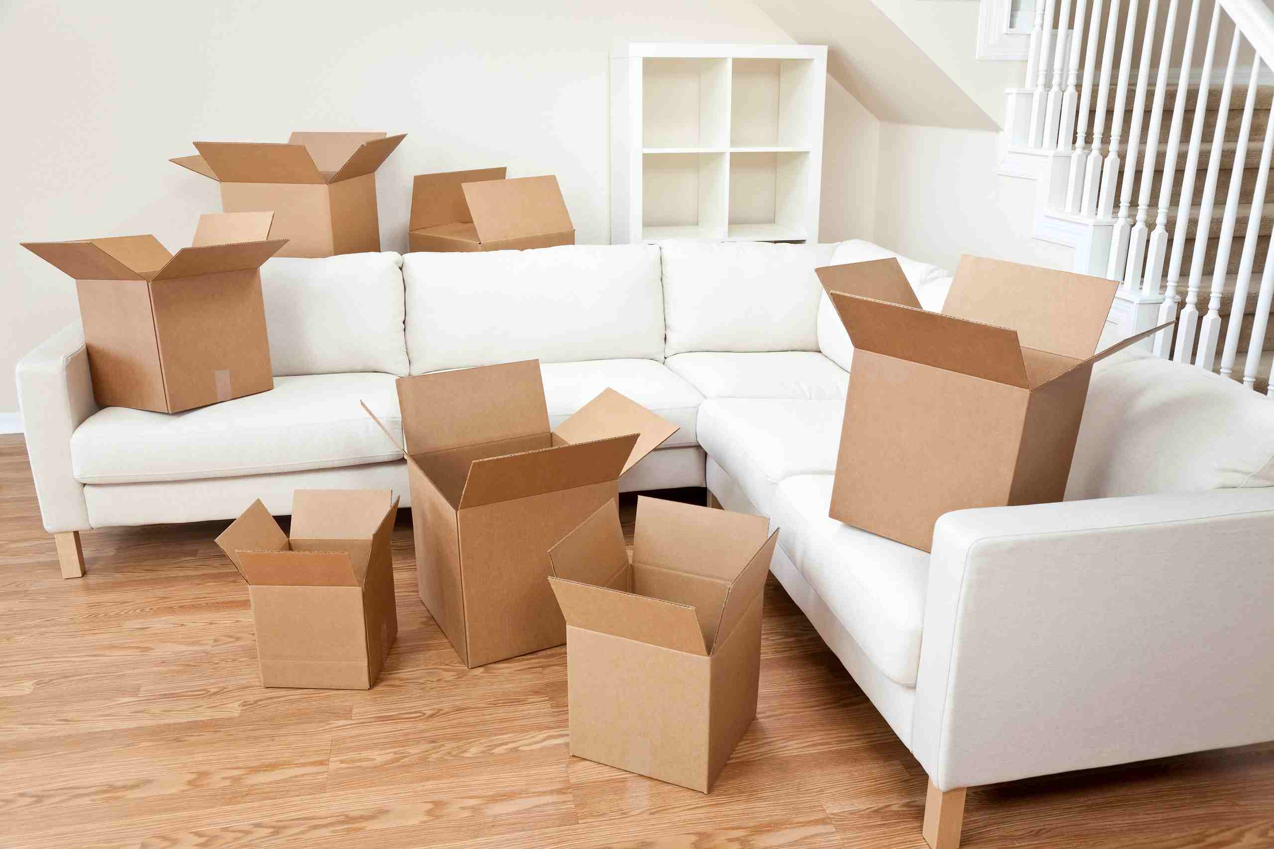 empty boxes on sofa and floor
