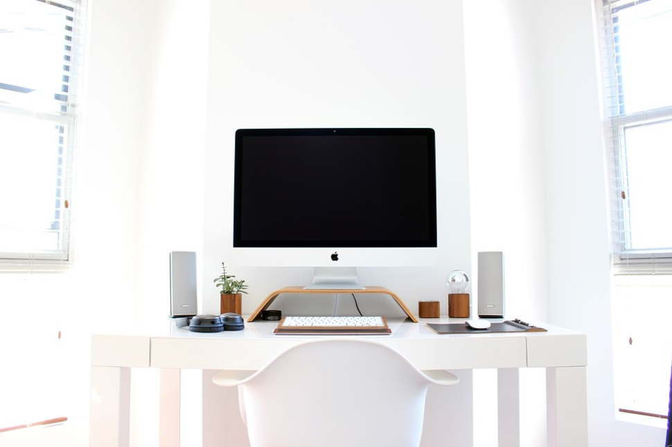 white themed office table chair mac windows wall speakers