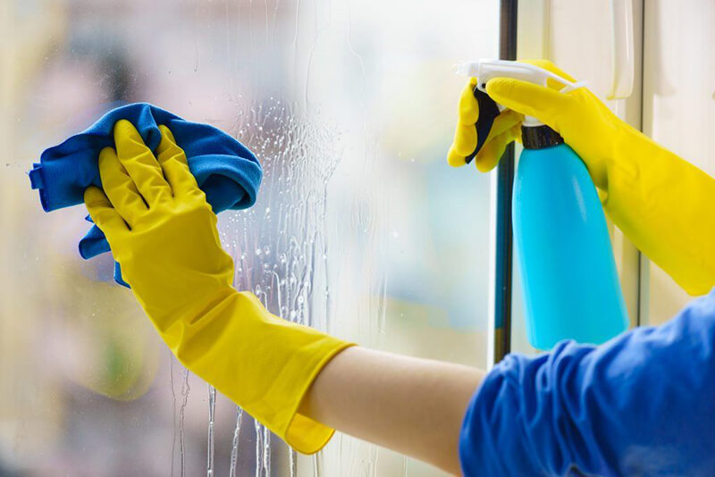 Disinfecting Windows cleaning window with disinfectant